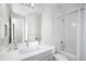 Bright bathroom with modern vanity, shower/tub combo, and stylish fixtures at 6 Wilder Ln, Littleton, CO 80123