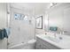 Bright bathroom with white subway tile shower and modern vanity at 6 Wilder Ln, Littleton, CO 80123