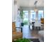Bright dining area with large windows and stylish chandelier, adjacent to the living area at 6 Wilder Ln, Littleton, CO 80123