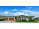 Charming single-story home with a manicured front yard, mature trees, and a welcoming entrance at 6 Wilder Ln, Littleton, CO 80123