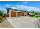 Modern home with an attached two car garage and a spacious driveway at 6 Wilder Ln, Littleton, CO 80123