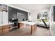 Spacious home office with built-ins, a large desk, and a treadmill for staying active at 6 Wilder Ln, Littleton, CO 80123