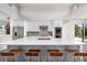 Contemporary kitchen with a large island, stainless steel appliances, and stylish white cabinets at 6 Wilder Ln, Littleton, CO 80123