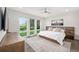 Spacious main bedroom features large windows with backyard views and contemporary decor at 6 Wilder Ln, Columbine Valley, CO 80123