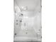 Contemporary shower features white subway tile, glass doors, and a built-in bench at 6 Wilder Ln, Littleton, CO 80123