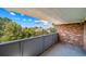 Balcony view with skyline, brick construction, and metal railing for safety at 1350 Josephine St # 508, Denver, CO 80206