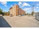 A well-maintained brick apartment building with ample parking space for residents and guests at 1350 Josephine St # 508, Denver, CO 80206