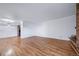 Open-concept living room featuring hardwood floors, flowing into the kitchen and brick fireplace at 1350 Josephine St # 508, Denver, CO 80206