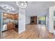 Open floor plan featuring a kitchen, living room with brick fireplace, plus access to the balcony at 1350 Josephine St # 508, Denver, CO 80206