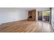 Spacious living room with hardwood floors, brick fireplace and sliding glass doors to balcony at 1350 Josephine St # 508, Denver, CO 80206