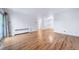 View of the open-concept living space with hardwood floors and sliding glass doors to the balcony at 1350 Josephine St # 508, Denver, CO 80206
