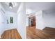 View of the open-concept living space featuring hardwood floors and a stainless steel fridge at 1350 Josephine St # 508, Denver, CO 80206