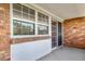 Spacious patio with brick accents and sliding glass door entry to the home at 1350 Josephine St # 508, Denver, CO 80206