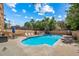 A refreshing community pool surrounded by lounge chairs and privacy fences for residents to enjoy at 1350 Josephine St # 508, Denver, CO 80206
