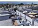 Aerial view of modern townhomes with multiple rooftop decks at 1615 Julian St # 102, Denver, CO 80204