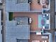 Aerial view of two rooftop decks with fire pit and patio furniture at 1615 Julian St # 102, Denver, CO 80204