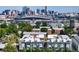 Modern city view of residential buildings with a stadium and skyline in the background, capturing the essence of urban living at 1615 Julian St # 102, Denver, CO 80204