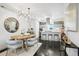 Modern dining area with a wooden table and sleek chairs at 1615 Julian St # 102, Denver, CO 80204