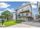 Modern townhome with lawn, balcony, and attached garage at 1615 Julian St # 102, Denver, CO 80204