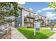 Modern townhome with front yard and walkway at 1615 Julian St # 102, Denver, CO 80204