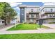 Modern townhome with front yard and walkway at 1615 Julian St # 102, Denver, CO 80204