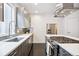 Contemporary kitchen featuring stainless steel appliances and sleek cabinetry at 1615 Julian St # 102, Denver, CO 80204