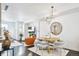 Bright living room featuring a comfortable seating area and dark hardwood floors at 1615 Julian St # 102, Denver, CO 80204