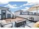 Spacious rooftop deck with fire pit, seating, and grill at 1615 Julian St # 102, Denver, CO 80204