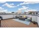 Spacious rooftop deck with fire pit, seating, and grill at 1615 Julian St # 102, Denver, CO 80204