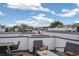 Rooftop deck with city views, seating area, and outdoor furniture at 1615 Julian St # 102, Denver, CO 80204