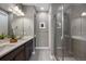 Modern bathroom with double vanity and large shower at 25146 E 1St Ave, Aurora, CO 80018