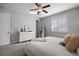 Well-lit bedroom with dresser and large windows at 25146 E 1St Ave, Aurora, CO 80018