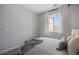 Light and airy bedroom with a view and striped bedding at 25146 E 1St Ave, Aurora, CO 80018