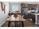 Kitchen dining area with wood table and built-in cabinetry at 25146 E 1St Ave, Aurora, CO 80018