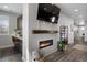 Modern fireplace with built-in shelving and workspace at 25146 E 1St Ave, Aurora, CO 80018