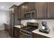 Eat-in kitchen with stainless steel appliances and white subway tile backsplash at 25146 E 1St Ave, Aurora, CO 80018