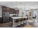 Modern kitchen with island, stainless steel appliances, and white countertops at 25146 E 1St Ave, Aurora, CO 80018