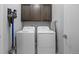 Laundry room with washer, dryer, and overhead cabinets at 25146 E 1St Ave, Aurora, CO 80018