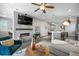 Open living space with fireplace and kitchen island at 25146 E 1St Ave, Aurora, CO 80018