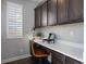 Built-in desk with cabinets and a window in home office at 25146 E 1St Ave, Aurora, CO 80018