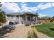 Backyard patio with seating area and built-in grill, next to the house at 25146 E 1St Ave, Aurora, CO 80018