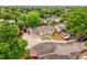 Aerial view of the house showcasing its location in a neighborhood with mature trees and a spacious driveway at 7751 Niagara St, Commerce City, CO 80022