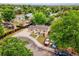 Aerial view of the home showing the surrounding neighborhood and mature greenery at 7751 Niagara St, Commerce City, CO 80022