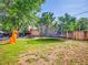A spacious and inviting backyard with a trampoline, shed, and outdoor furniture at 7751 Niagara St, Commerce City, CO 80022