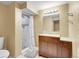 Cozy bathroom featuring a shower with a white shower curtain, modern vanity, and neutral paint at 7751 Niagara St, Commerce City, CO 80022