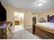 Bedroom with ensuite bathroom and closet access at 7751 Niagara St, Commerce City, CO 80022