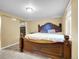 Bedroom with a luxurious wooden bed frame and soft lighting at 7751 Niagara St, Commerce City, CO 80022