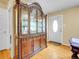 Dining room features a china cabinet, doorway, and entrance to the kitchen at 7751 Niagara St, Commerce City, CO 80022