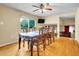 Dining room features a large table with view to the kitchen and living room at 7751 Niagara St, Commerce City, CO 80022