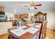 Dining room features a large table with a view to the kitchen at 7751 Niagara St, Commerce City, CO 80022